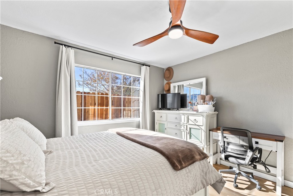 8755 Devon Avenue Hesperia, CA 92345 - Photo 21 of 45 a bedroom with a bed and a large window