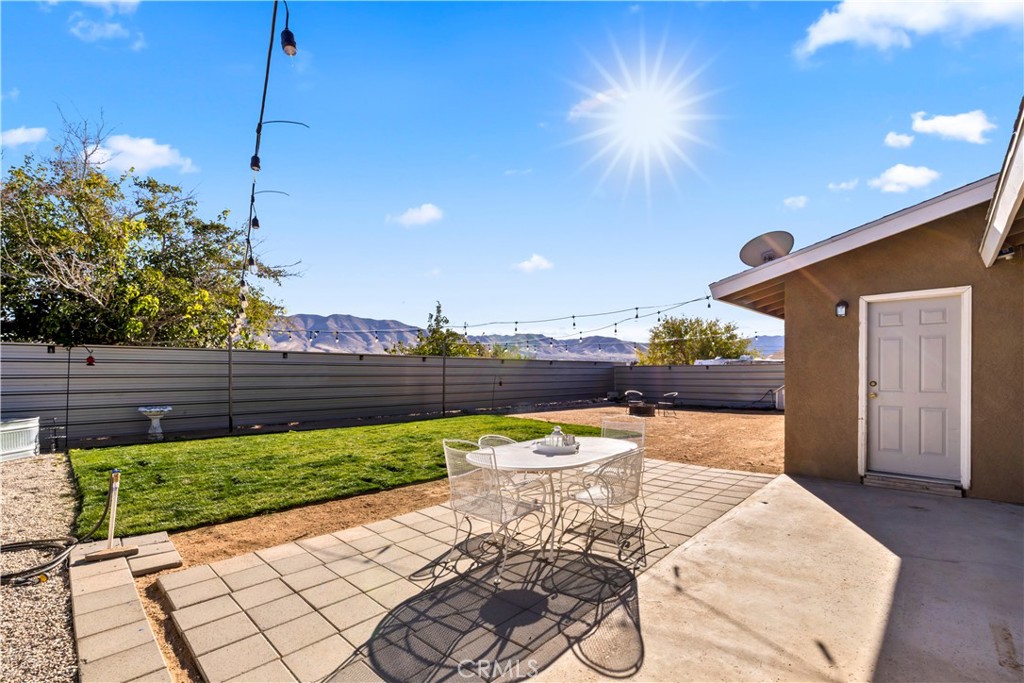 8755 Devon Avenue Hesperia, CA 92345 - Photo 30 of 45 a view of a chairs and table in backyard