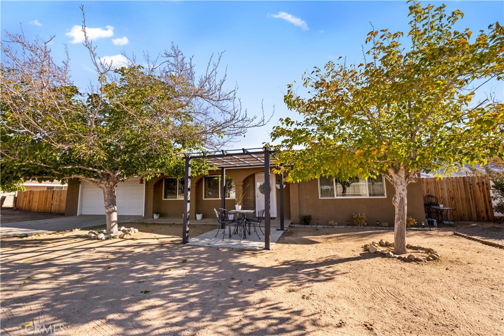 8755 Devon Avenue Hesperia, CA 92345 - Photo 39 of 45 a front view of a building with a tree in front