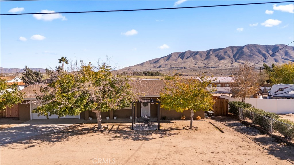 8755 Devon Avenue Hesperia, CA 92345 - Photo 43 of 45 a view of a house with a snow in the background