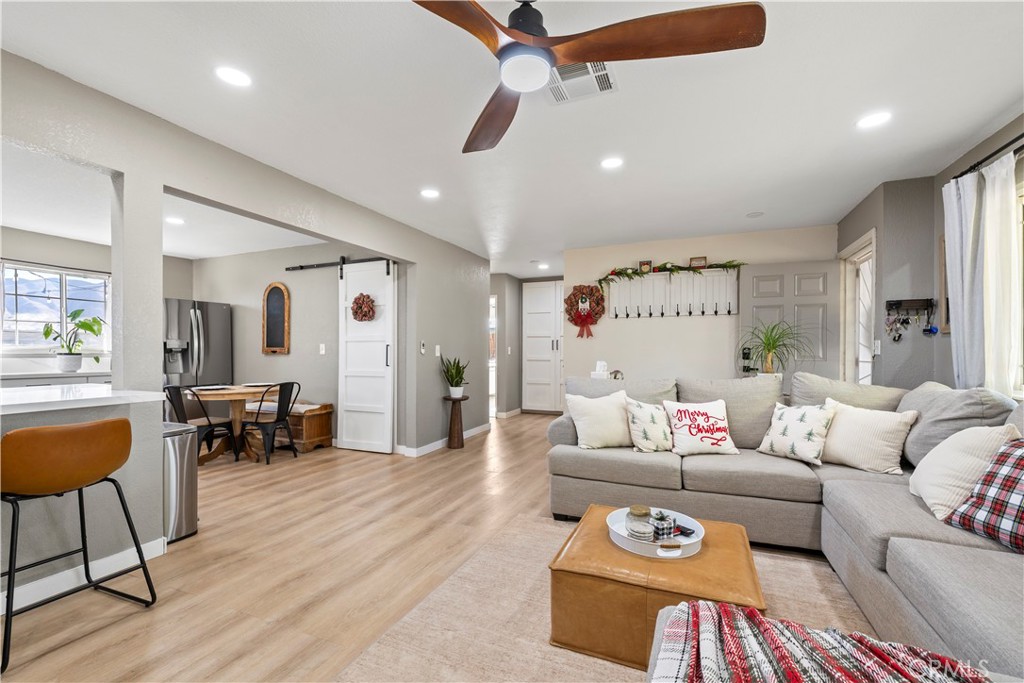 8755 Devon Avenue Hesperia, CA 92345 - Photo 5 of 45 a living room with furniture and a wooden floor