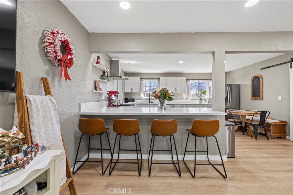 8755 Devon Avenue Hesperia, CA 92345 - Photo 8 of 45 a kitchen with a table and chairs in it