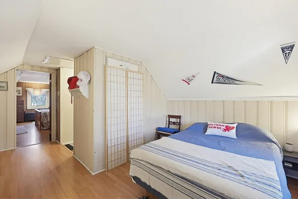 a bedroom with a bed and a closet