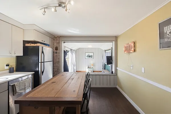 a kitchen with a refrigerator a sink and cabinets