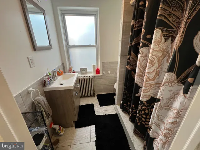 a white toilet sitting next to a small yard