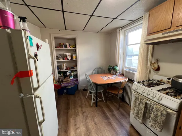 a bedroom with furniture and a flat screen tv