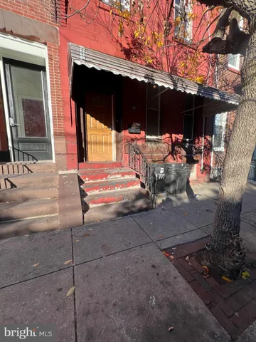 a view of a patio with table and chairs and potted plants