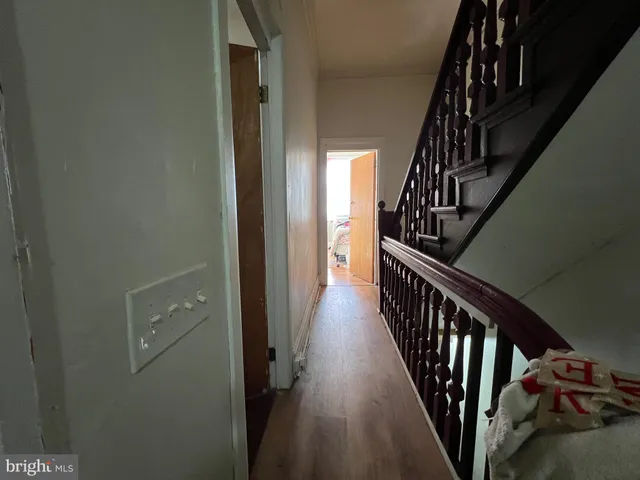 a bathroom with a toilet and a shower curtain