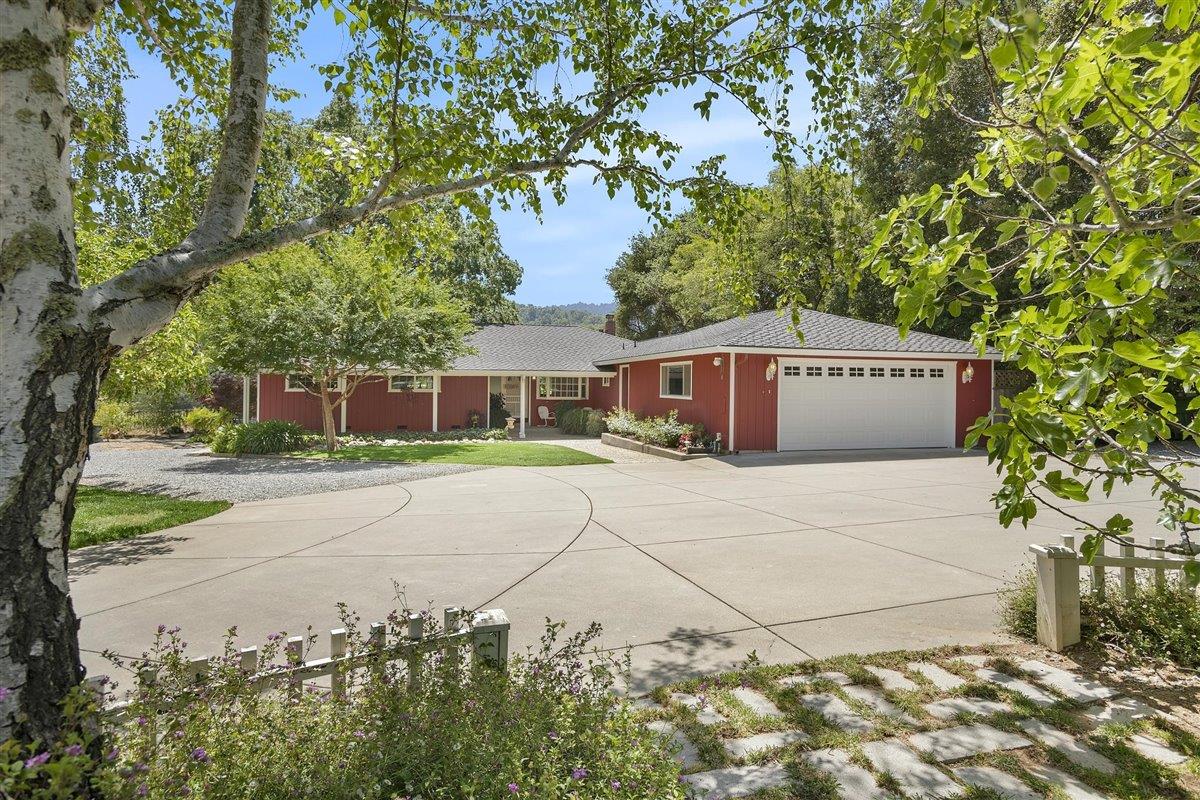 8085 Solis Rancho Drive Gilroy, CA 95020 - Photo 1 of 26 a front view of a house with a garden