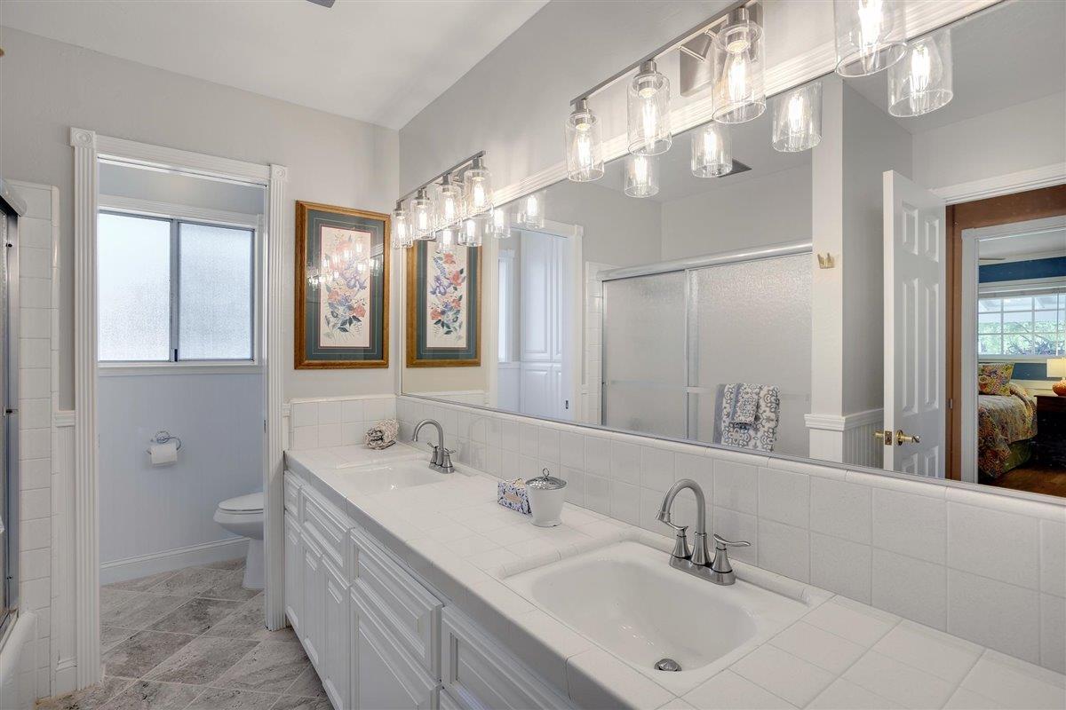 8085 Solis Rancho Drive Gilroy, CA 95020 - Photo 11 of 26 a bathroom with a double vanity sink mirror and double