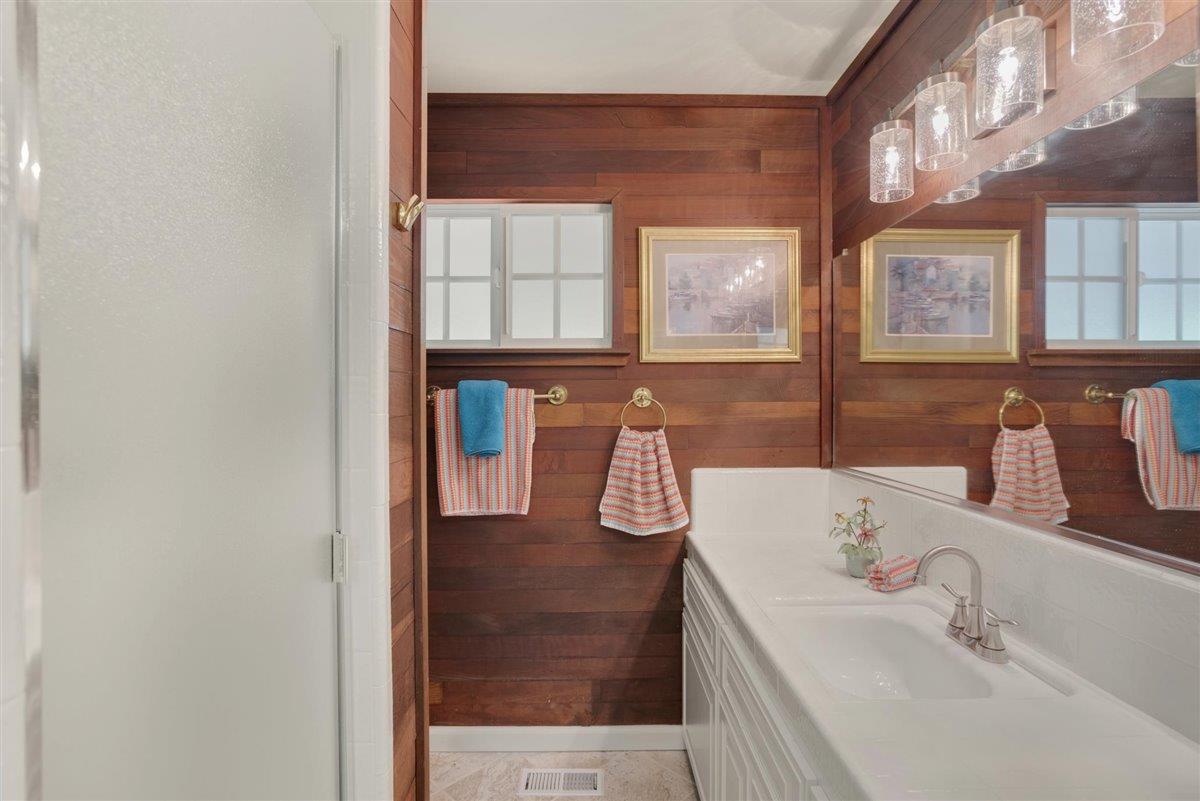 8085 Solis Rancho Drive Gilroy, CA 95020 - Photo 18 of 26 a bathroom with a sink and a mirror