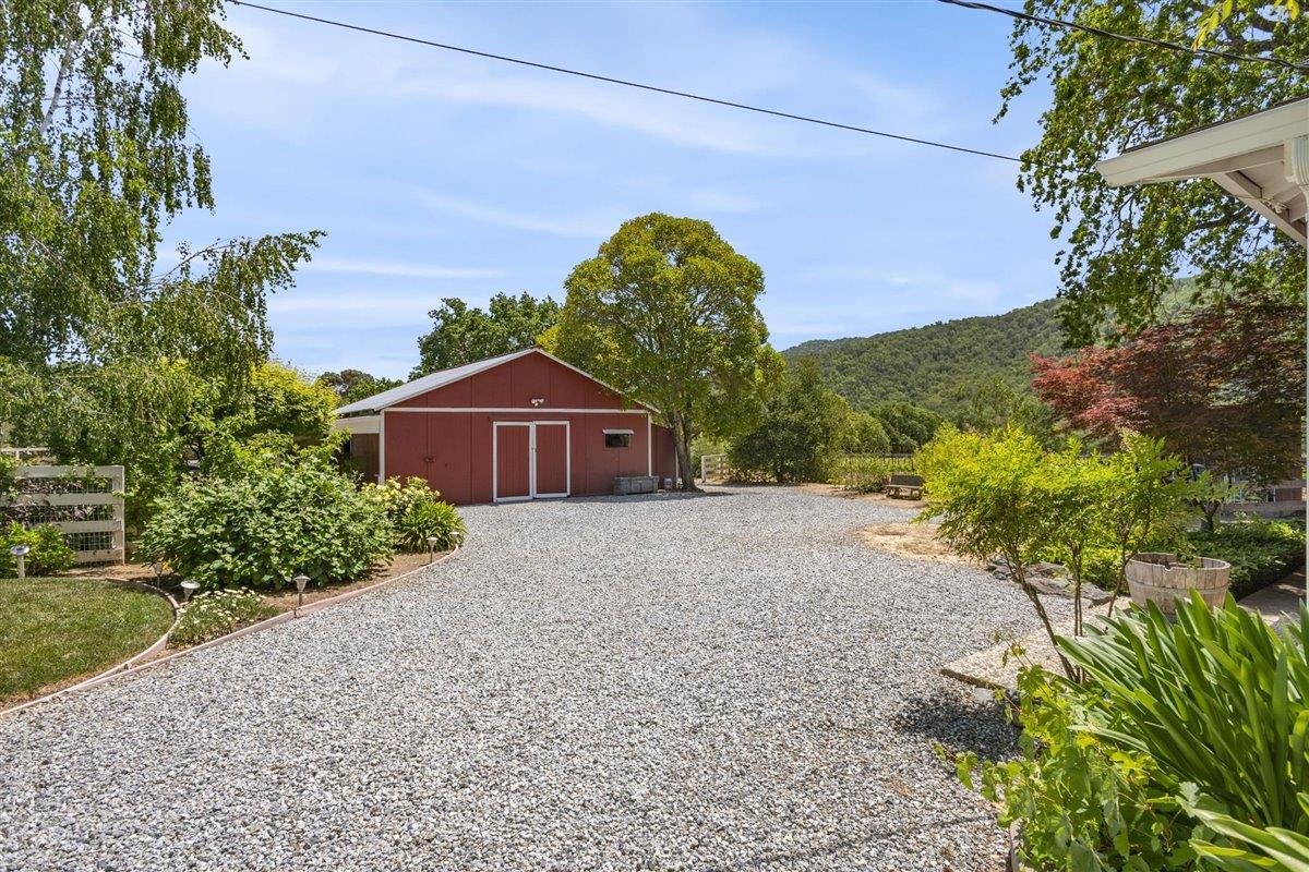 8085 Solis Rancho Drive Gilroy, CA 95020 - Photo 4 of 26 a front view of a house with a yard and garage