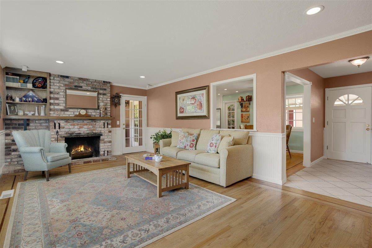 8085 Solis Rancho Drive Gilroy, CA 95020 - Photo 7 of 26 a living room with furniture and a fireplace