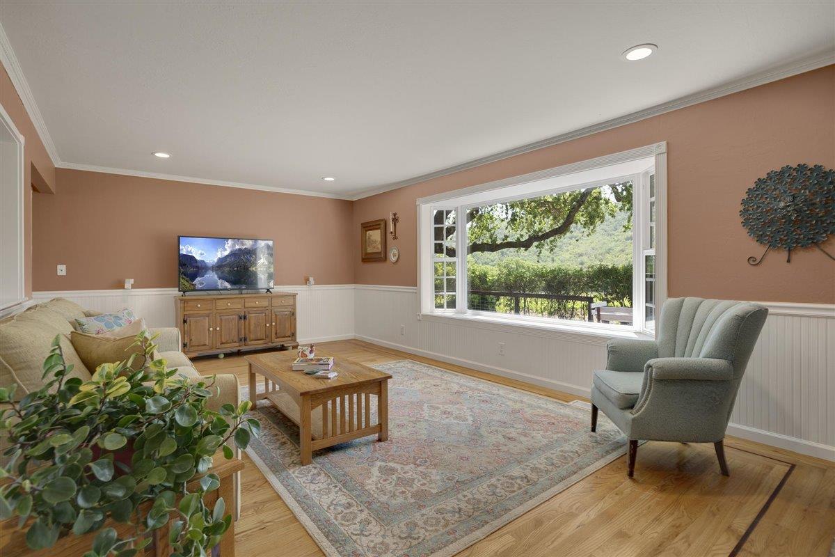 8085 Solis Rancho Drive Gilroy, CA 95020 - Photo 8 of 26 a living room with furniture and a large window