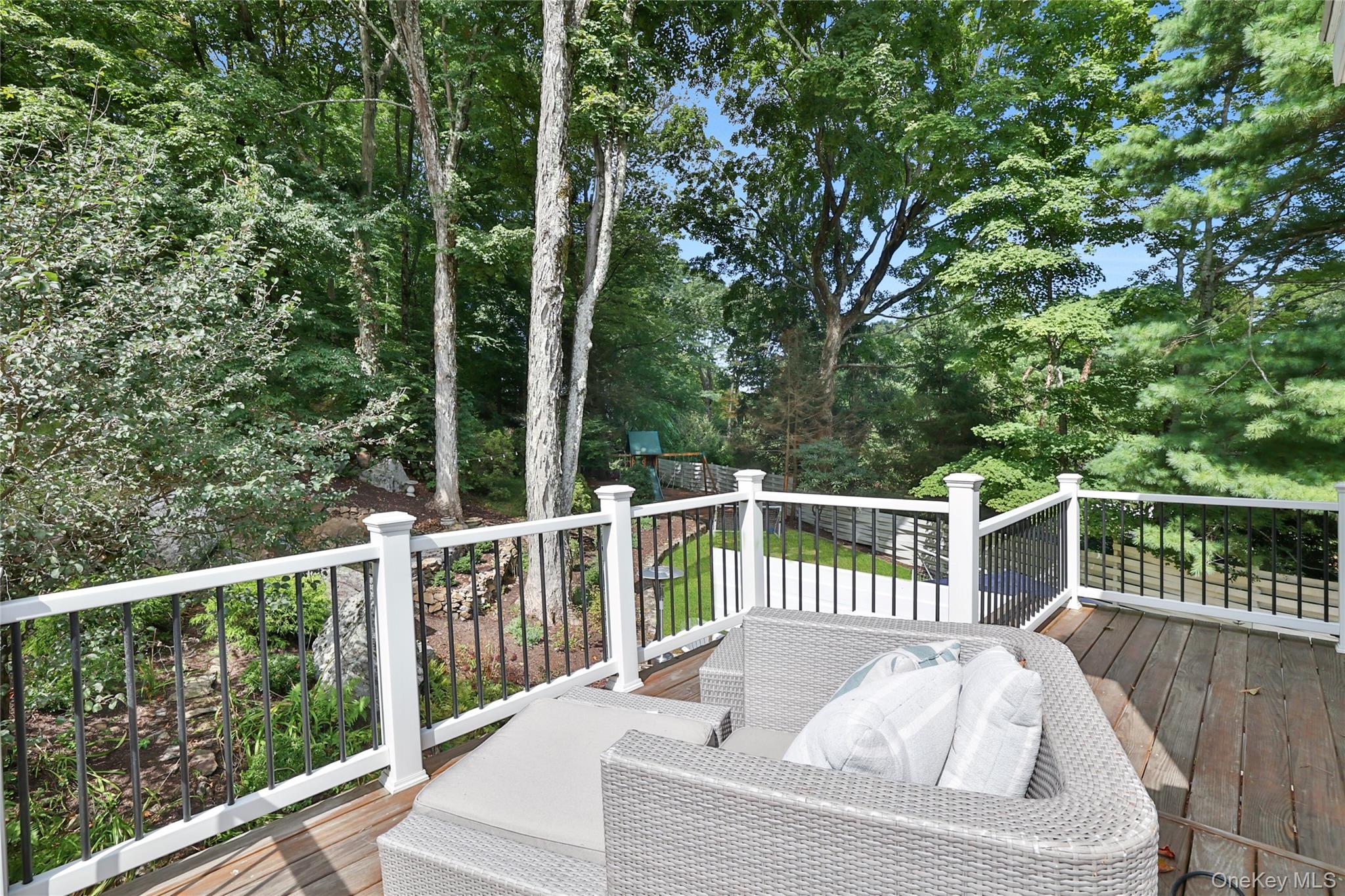 8 Old Roaring Brook Road Mount Kisco, NY 10549 - Photo 22 of 47 a view of a deck with two chairs and a table