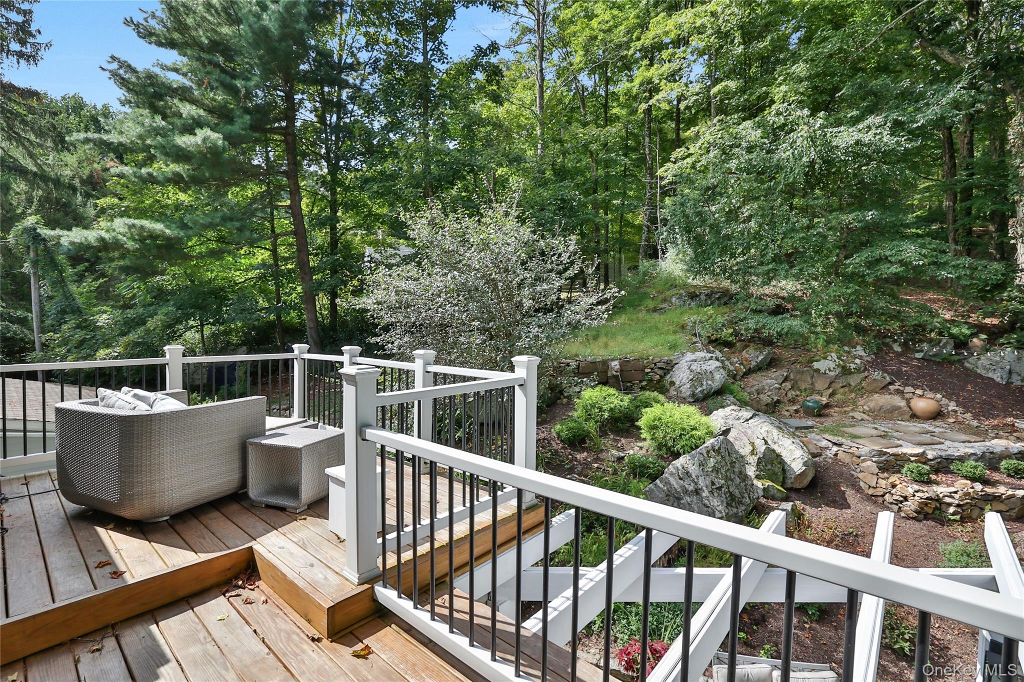 8 Old Roaring Brook Road Mount Kisco, NY 10549 - Photo 23 of 47 a view of a balcony with chair and iron fence