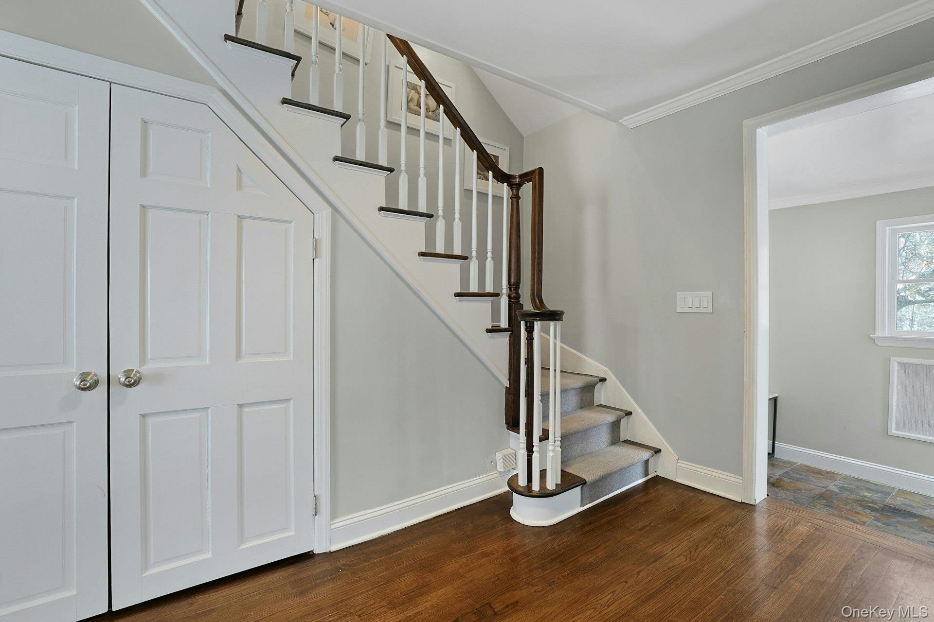 8 Old Roaring Brook Road Mount Kisco, NY 10549 - Photo 24 of 47 a view of an entryway with wooden floor and stairs