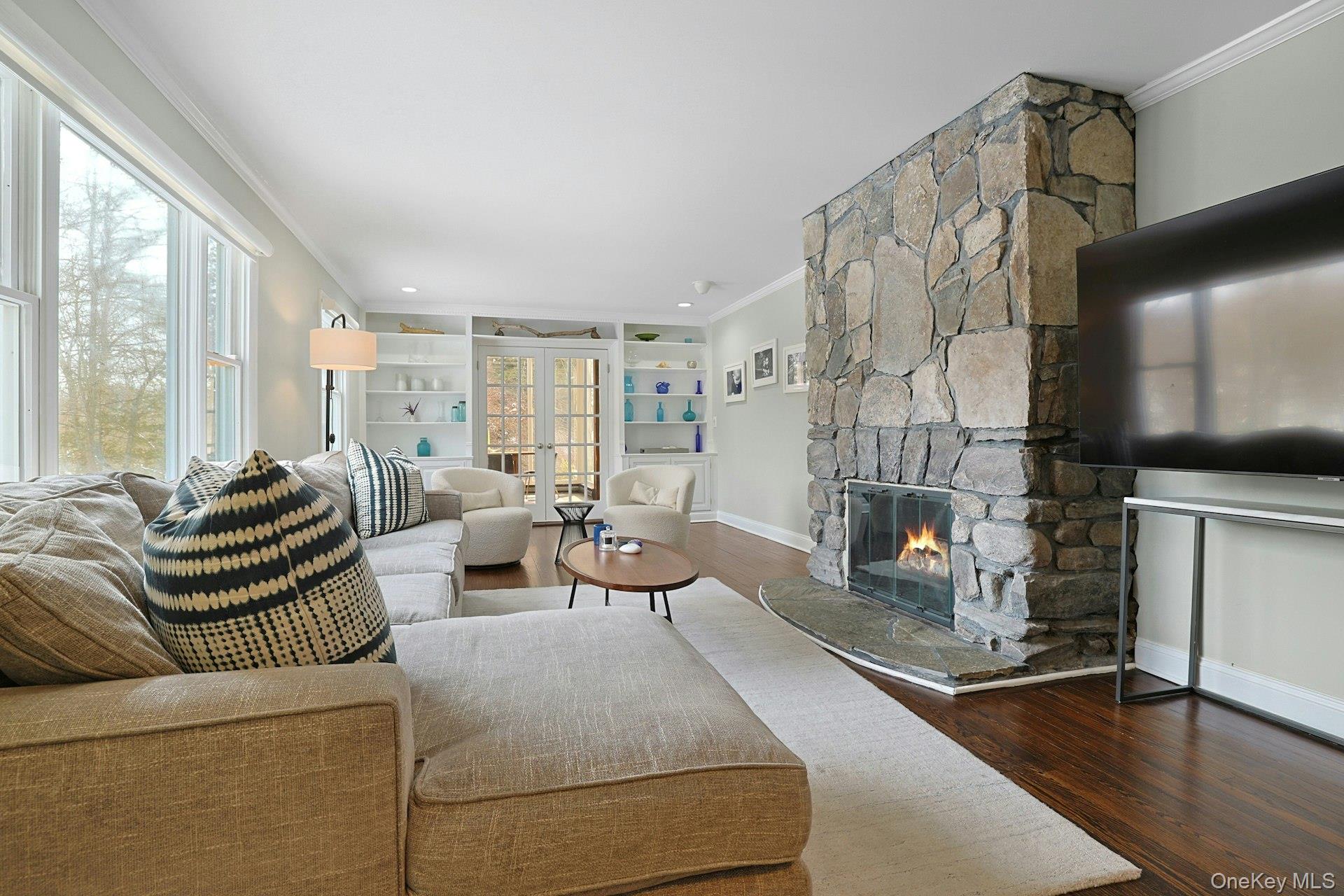 8 Old Roaring Brook Road Mount Kisco, NY 10549 - Photo 25 of 47 a living room with furniture and a fireplace