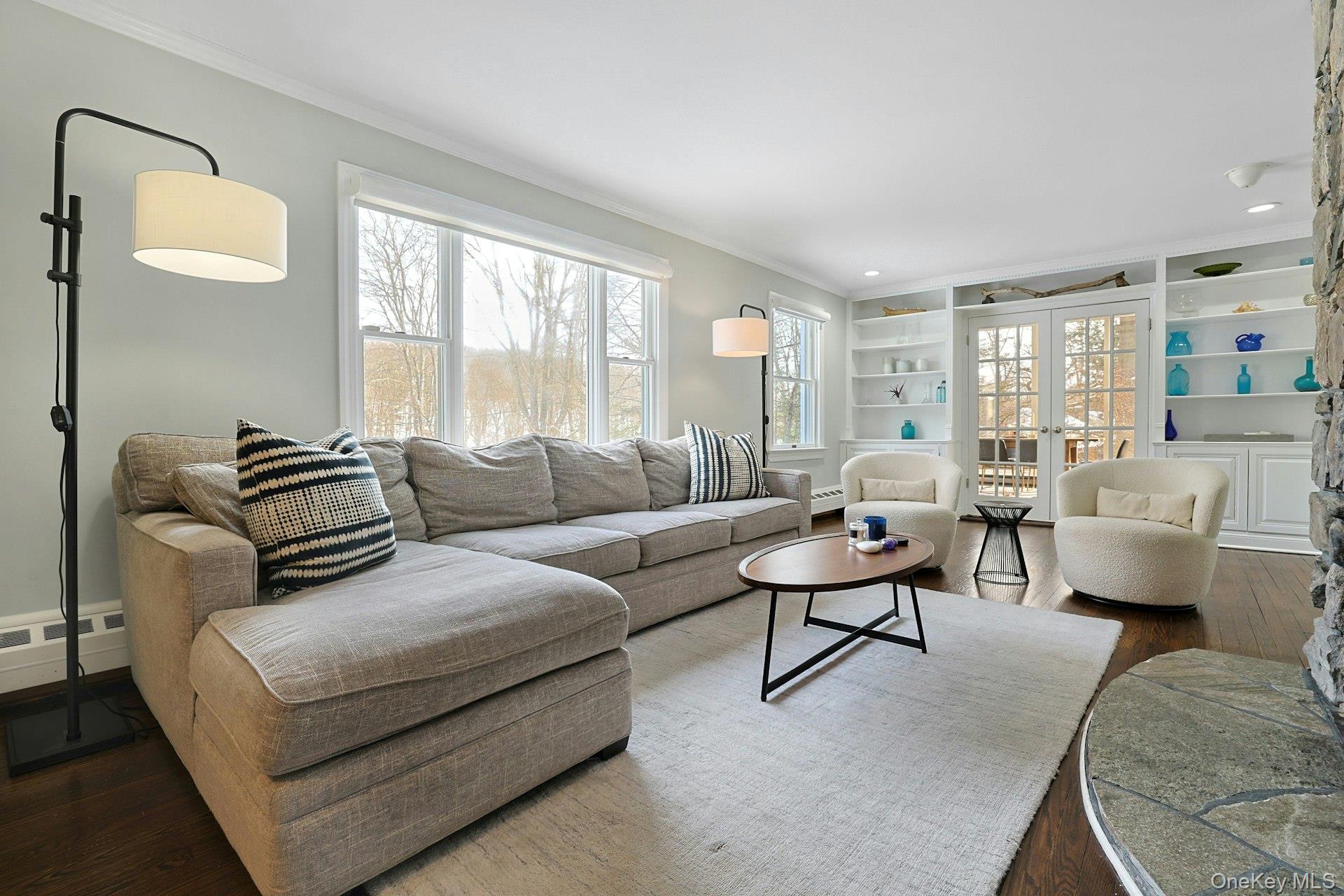 8 Old Roaring Brook Road Mount Kisco, NY 10549 - Photo 26 of 47 a living room with furniture and a large window