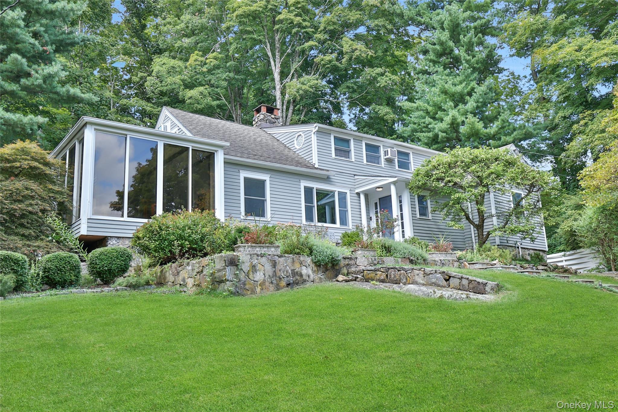 8 Old Roaring Brook Road Mount Kisco, NY 10549 - Photo 3 of 47 a front view of house with yard and green space