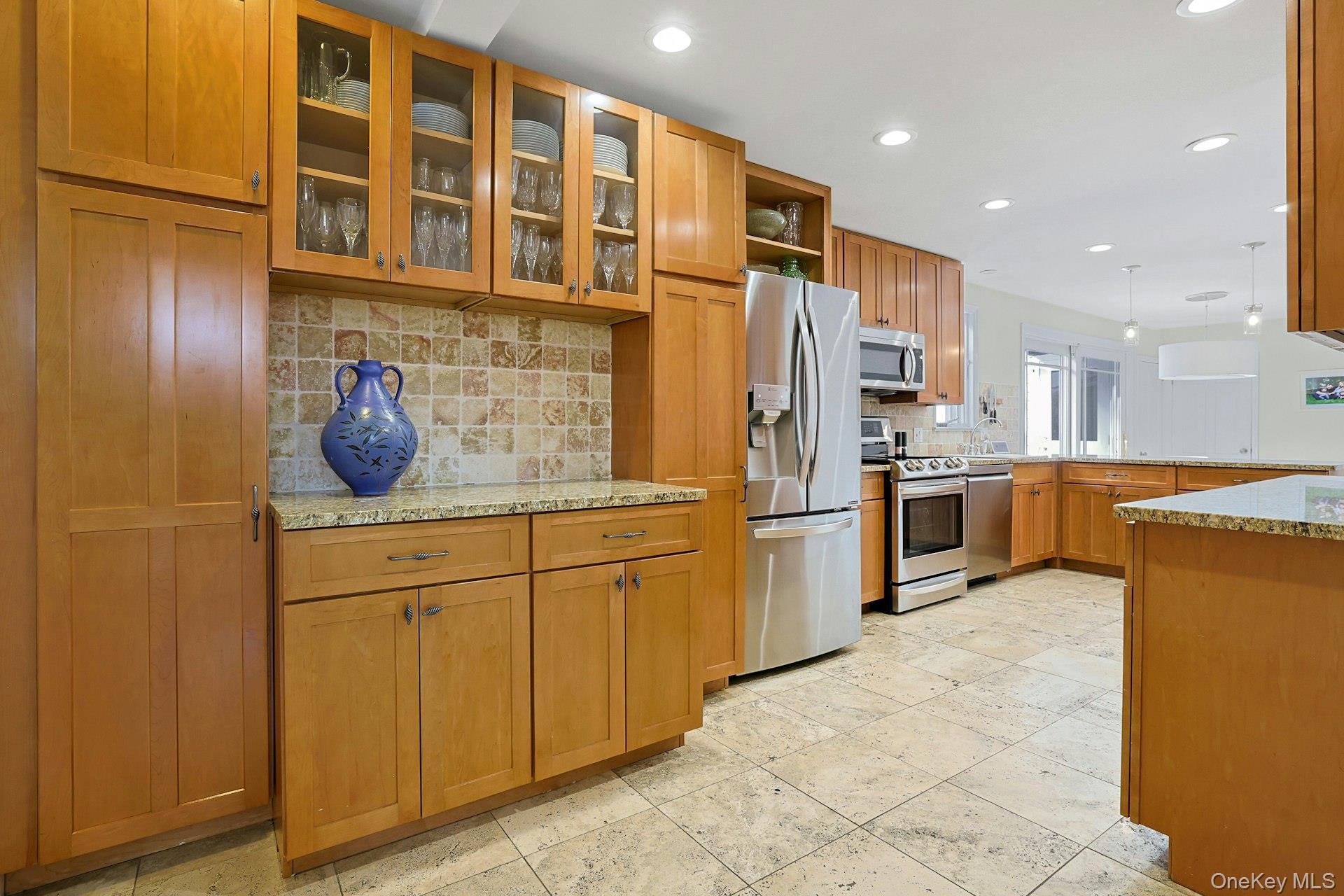 8 Old Roaring Brook Road Mount Kisco, NY 10549 - Photo 31 of 47 a kitchen with stainless steel appliances granite countertop a sink and cabinets