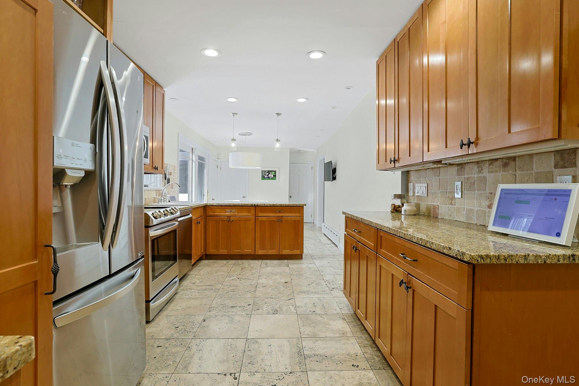 8 Old Roaring Brook Road Mount Kisco, NY 10549 - Photo 32 of 47 a kitchen with stainless steel appliances granite countertop lots of counter top space and cabinets