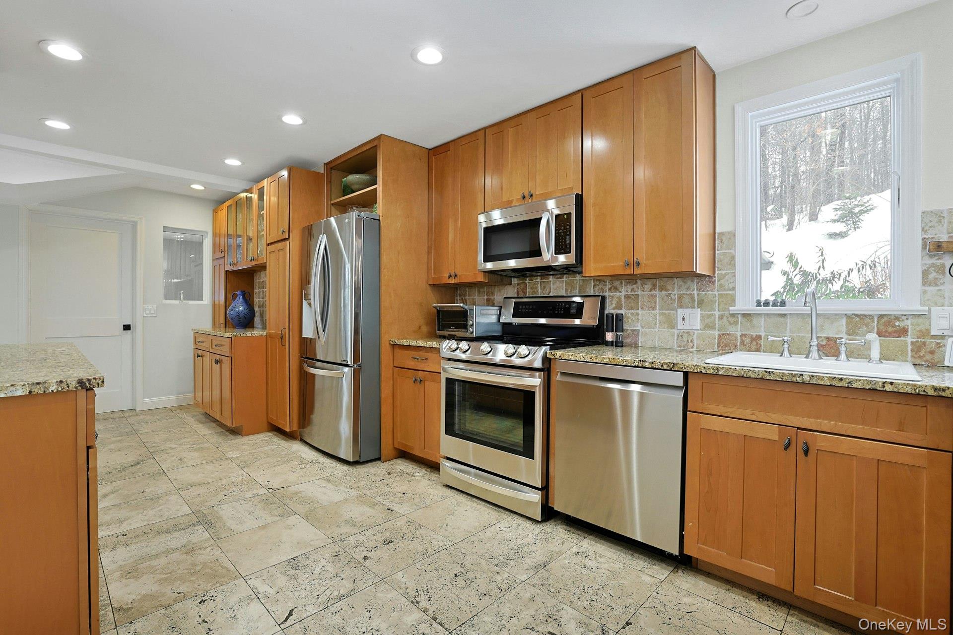 8 Old Roaring Brook Road Mount Kisco, NY 10549 - Photo 33 of 47 a kitchen with stainless steel appliances a refrigerator sink and microwave