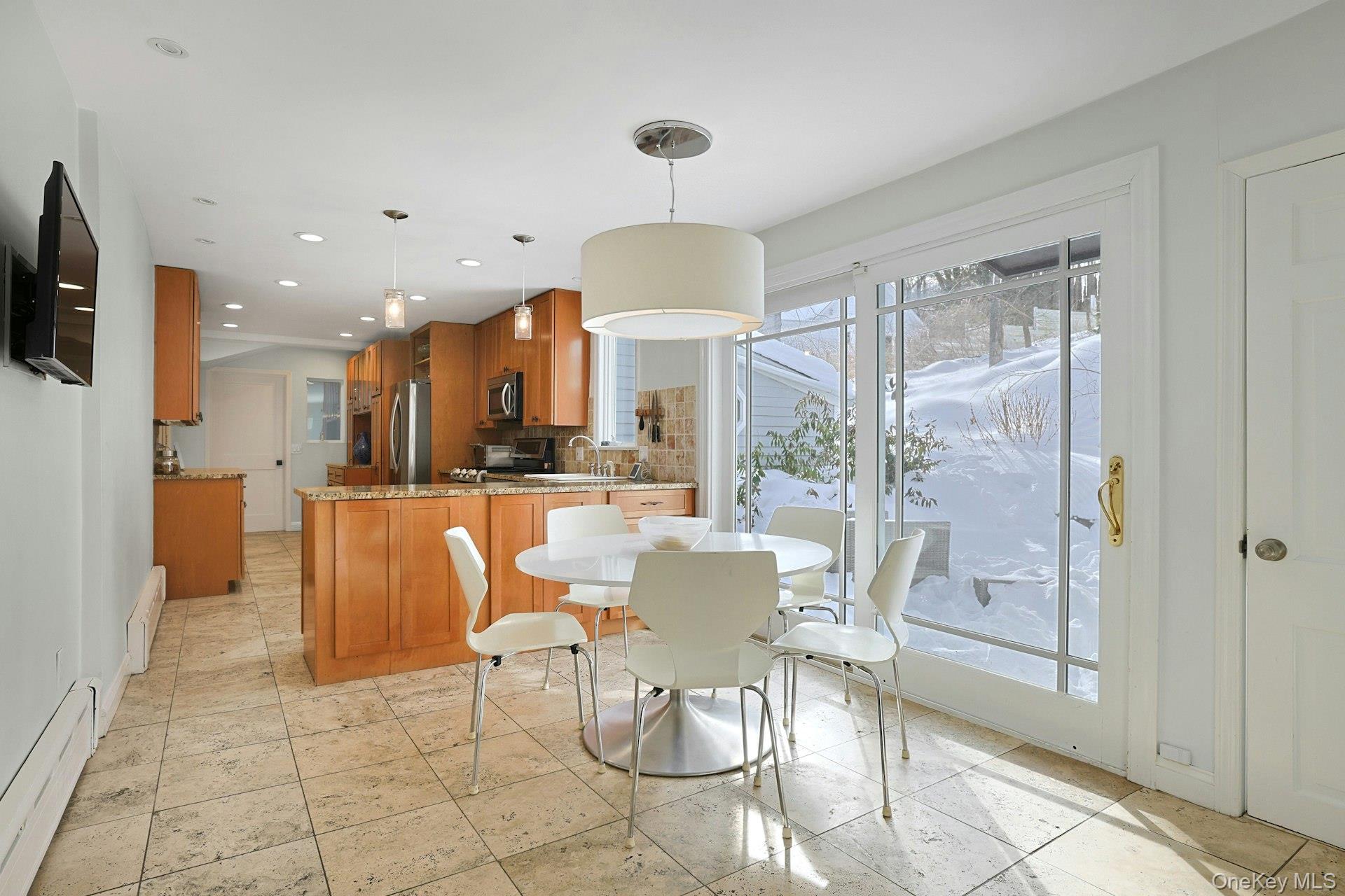 8 Old Roaring Brook Road Mount Kisco, NY 10549 - Photo 34 of 47 a dining room with furniture a rug and a chandelier