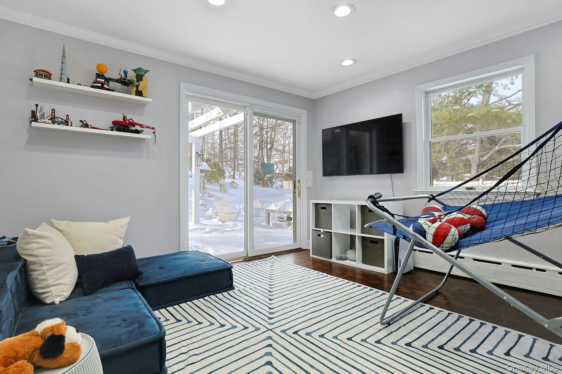 8 Old Roaring Brook Road Mount Kisco, NY 10549 - Photo 36 of 47 a living room with furniture and a flat screen tv