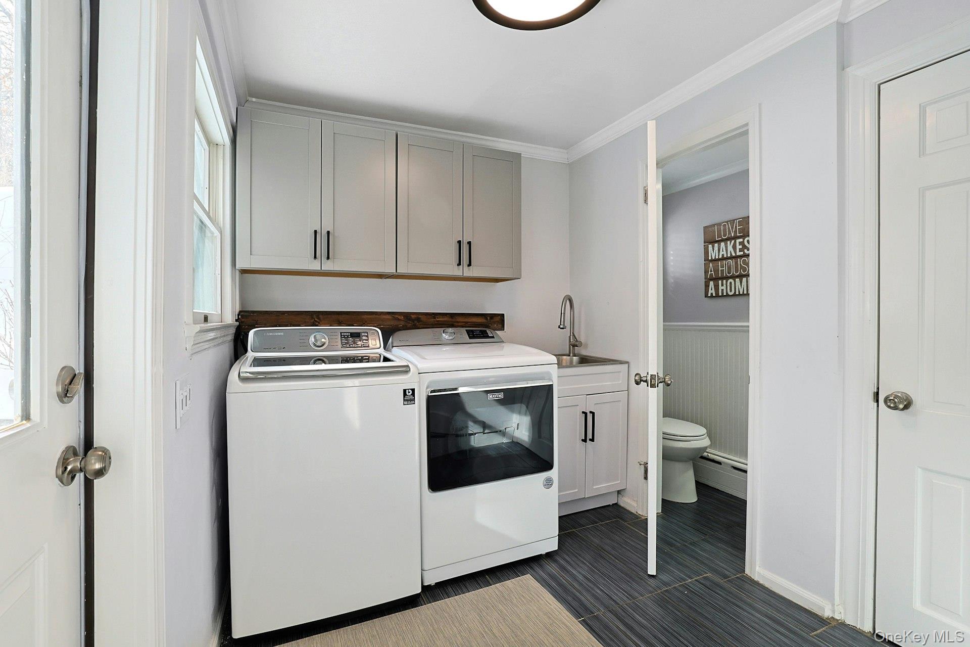 8 Old Roaring Brook Road Mount Kisco, NY 10549 - Photo 37 of 47 a view of a storage and utility room with washer and dryer