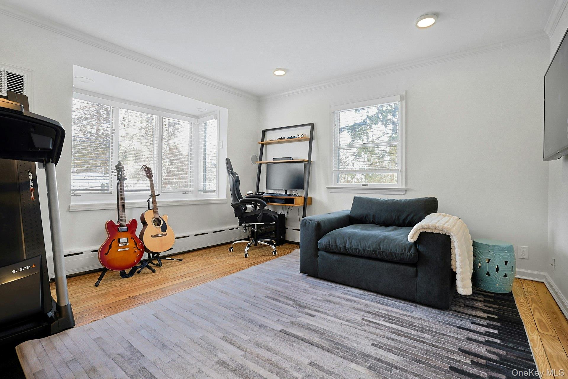 8 Old Roaring Brook Road Mount Kisco, NY 10549 - Photo 38 of 47 a living room with furniture hard wood floor and a flat screen tv