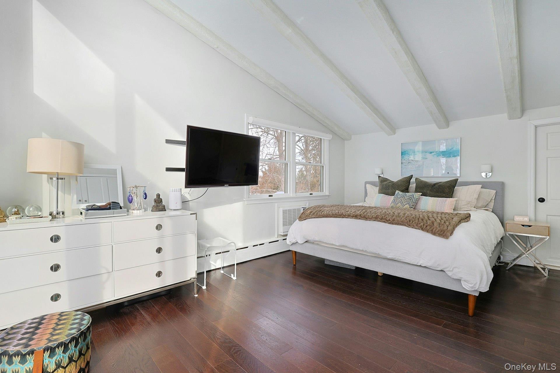 8 Old Roaring Brook Road Mount Kisco, NY 10549 - Photo 44 of 47 a spacious bedroom with a bed and a flat screen tv