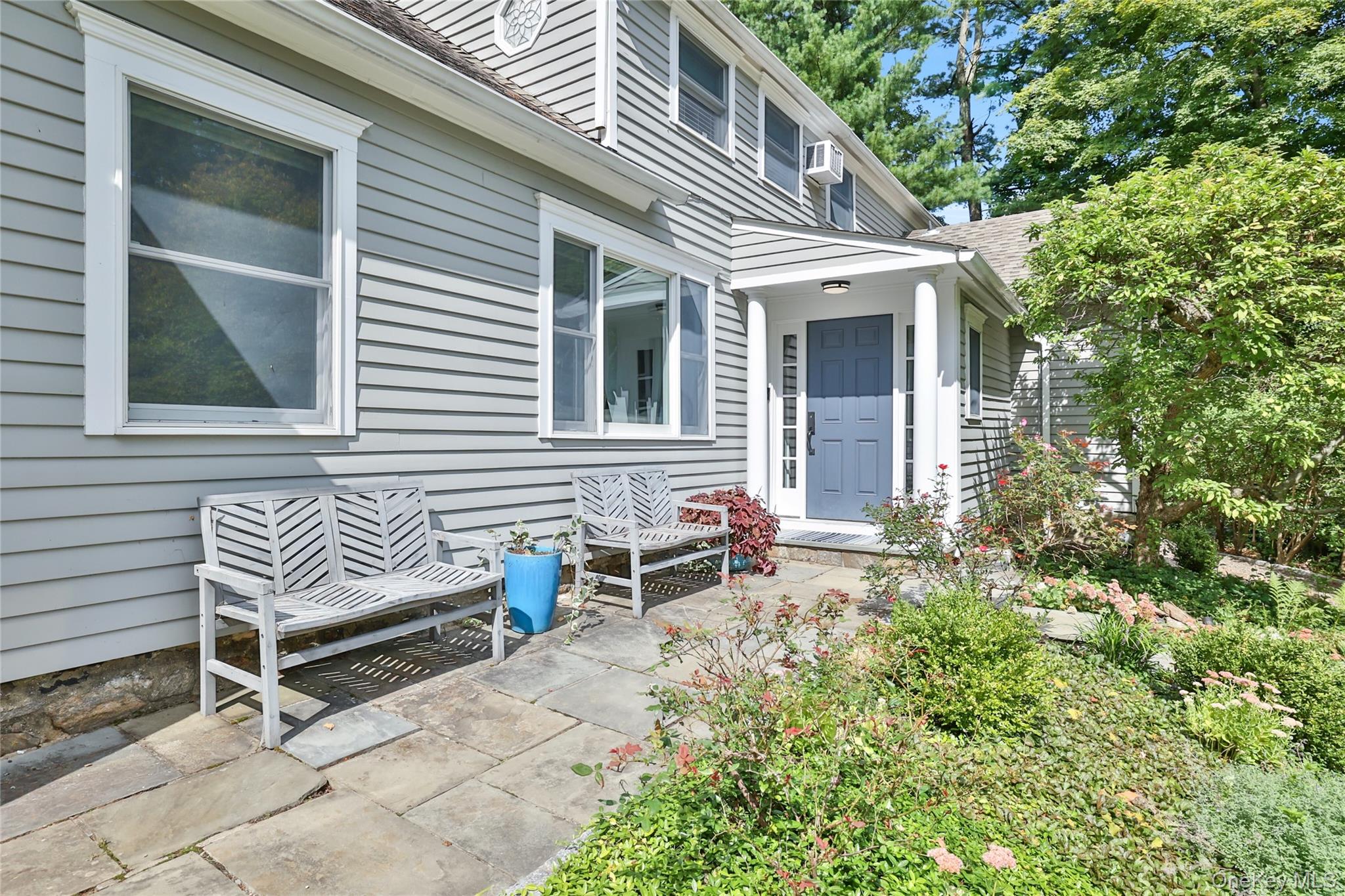 8 Old Roaring Brook Road Mount Kisco, NY 10549 - Photo 5 of 47 a front view of a house with a sitting area