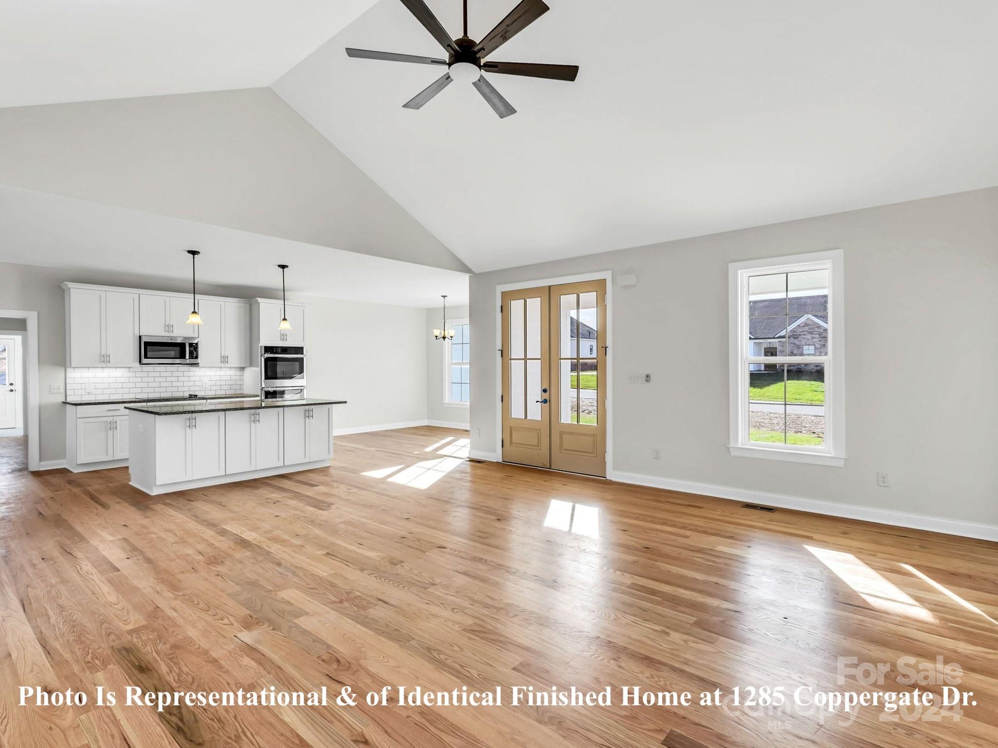 1375 Coppergate Drive Salisbury, NC 28147 - Photo 18 of 41 a view of an empty room with window and wooden floor