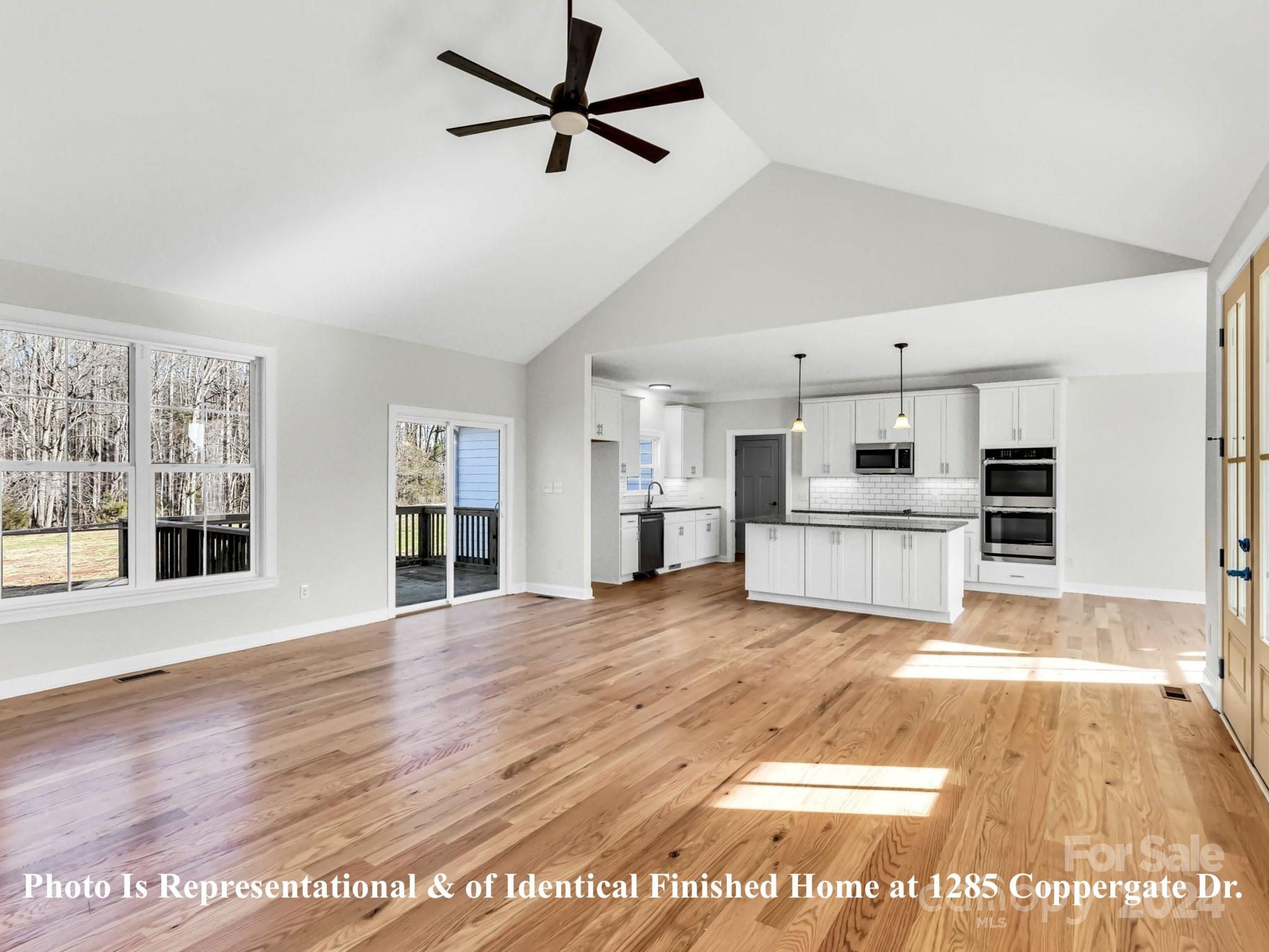 1375 Coppergate Drive Salisbury, NC 28147 - Photo 19 of 41 a view of an empty room with kitchen appliances and a window