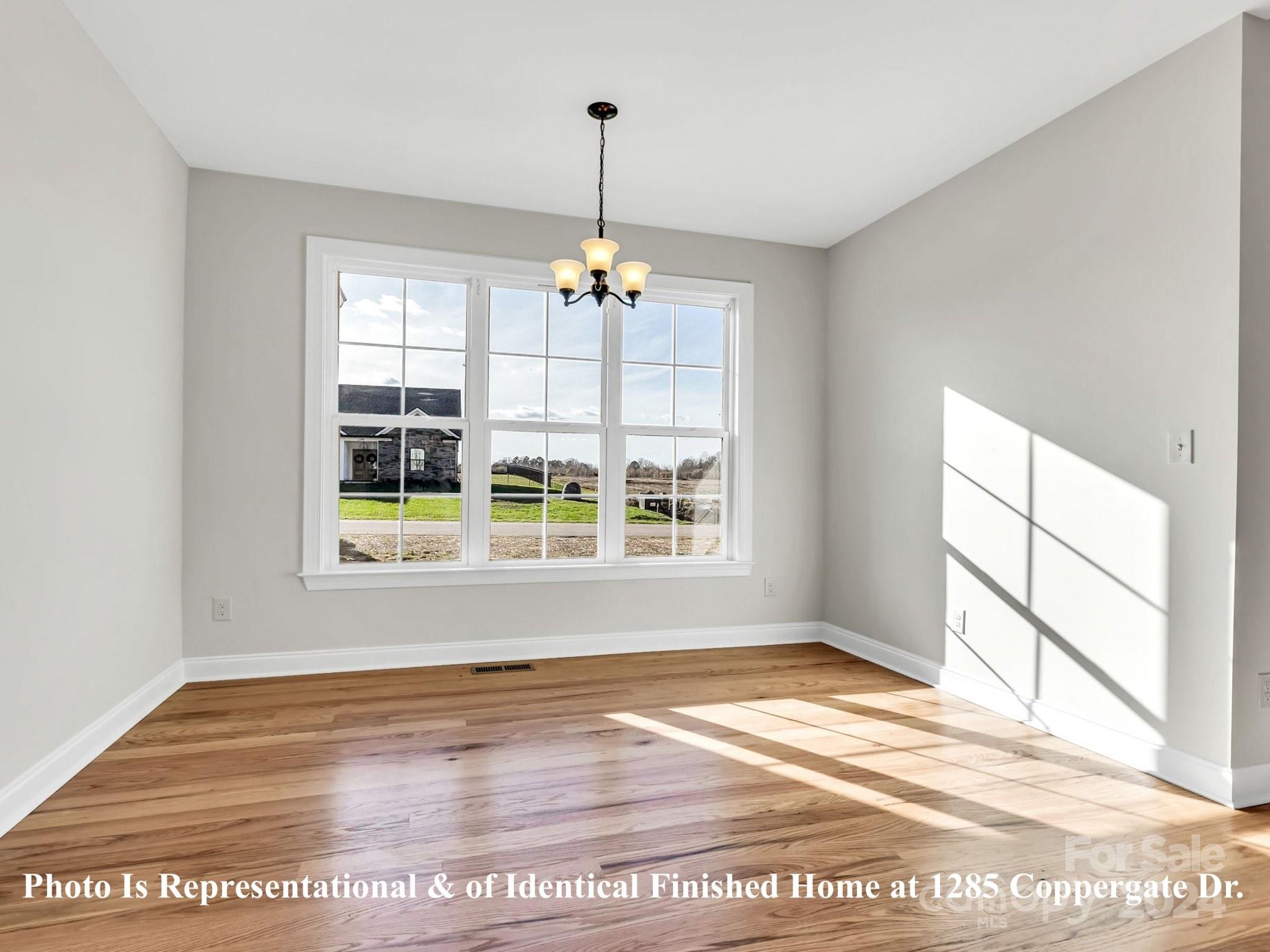 1375 Coppergate Drive Salisbury, NC 28147 - Photo 23 of 41 a view of a room with wooden floor and windows