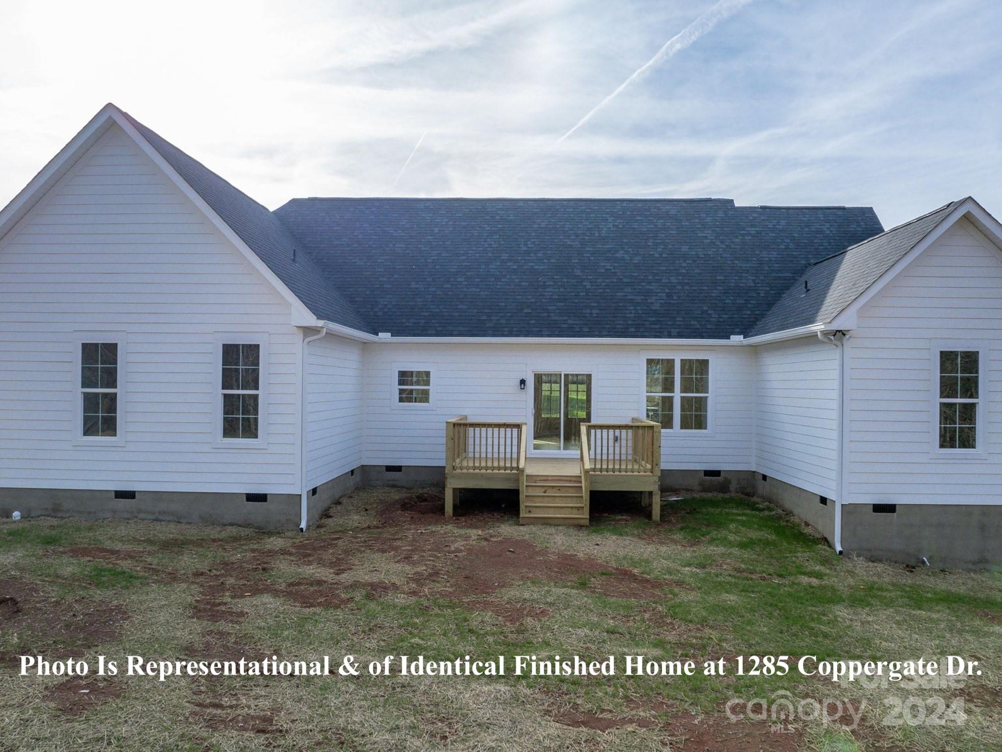 1375 Coppergate Drive Salisbury, NC 28147 - Photo 34 of 41 a backyard of a house with barbeque oven table and chairs