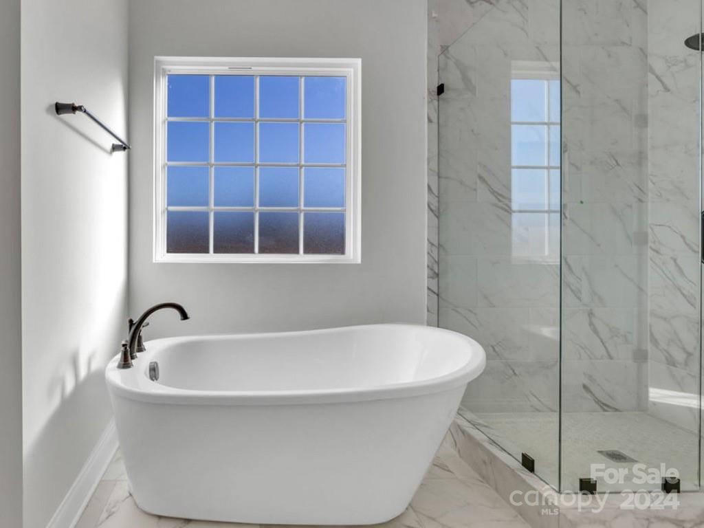 1375 Coppergate Drive Salisbury, NC 28147 - Photo 35 of 41 a white bath tub sitting next to a shower