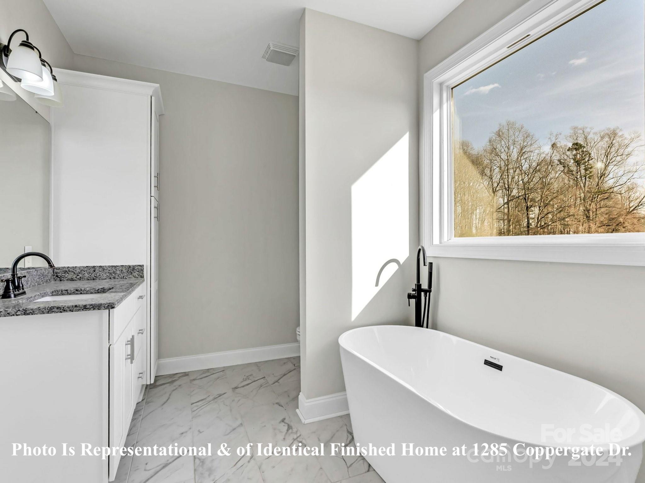 1375 Coppergate Drive Salisbury, NC 28147 - Photo 36 of 41 a white bath tub sitting next to a white sink