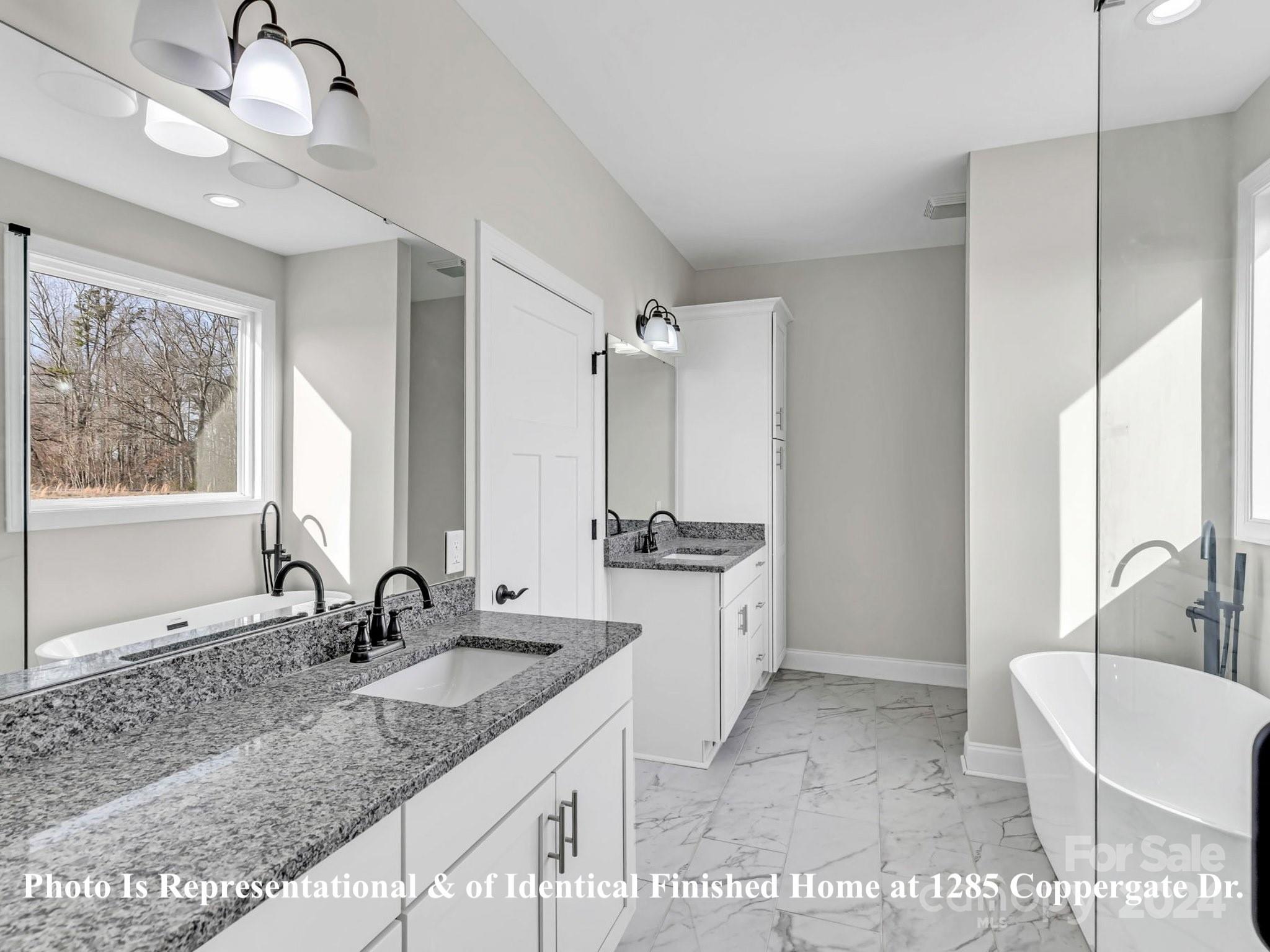 1375 Coppergate Drive Salisbury, NC 28147 - Photo 4 of 41 a bathroom with a granite countertop sink mirror and a bath tub