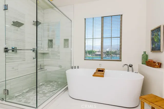 a white bath tub sitting next to a window