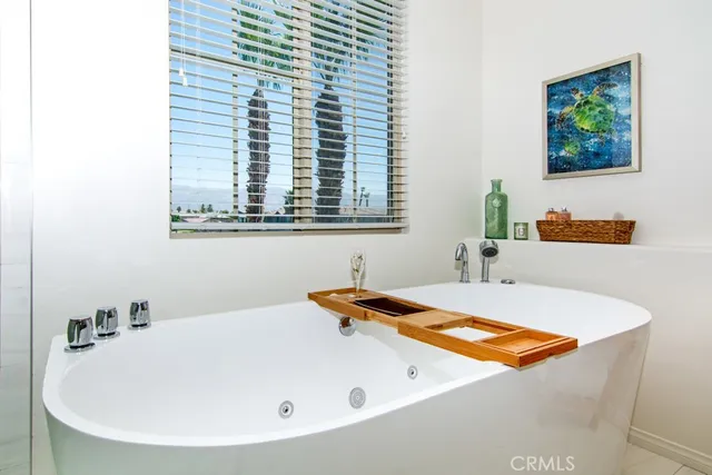 a bathroom with a tub and sink