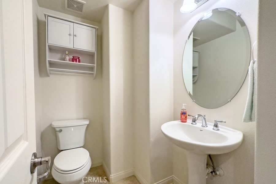 43183 Bacino Court Indio, CA 92203 - Photo 19 of 20 a bathroom with a toilet sink and mirror