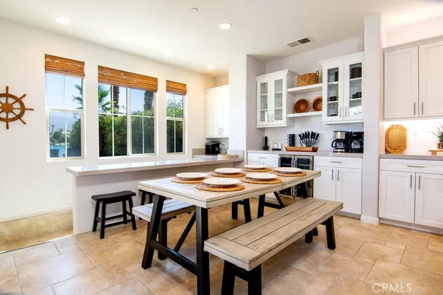 a outdoor dining space with furniture and window