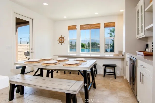 a view of a dining room with furniture and window