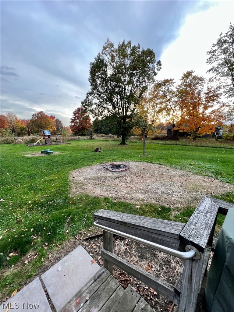 3992 Tallmadge Road Rootstown, OH 44272 - Photo 18 of 27 View of yard with a fire pit