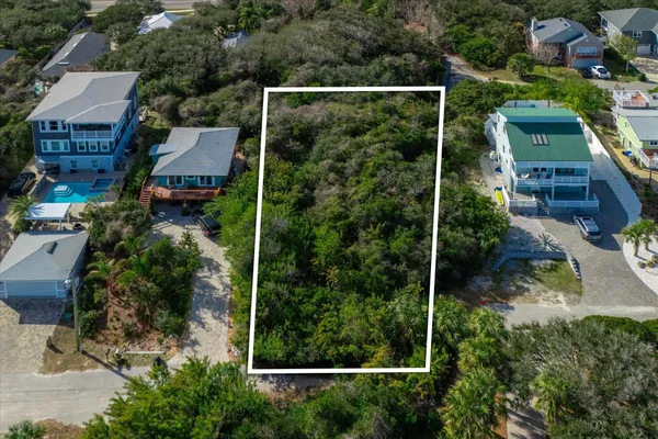 an aerial view of house with a yard