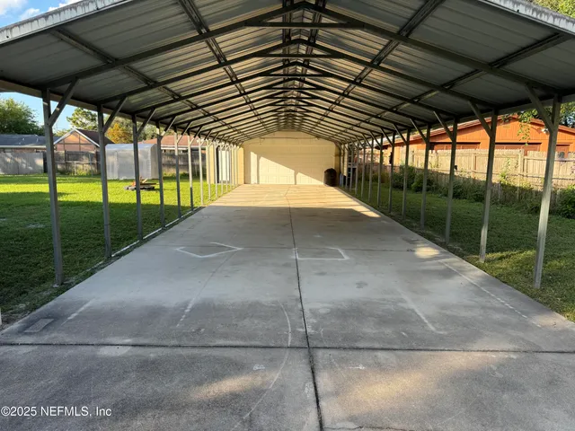 a kitchen with kitchen island a stove a sink and a refrigerator