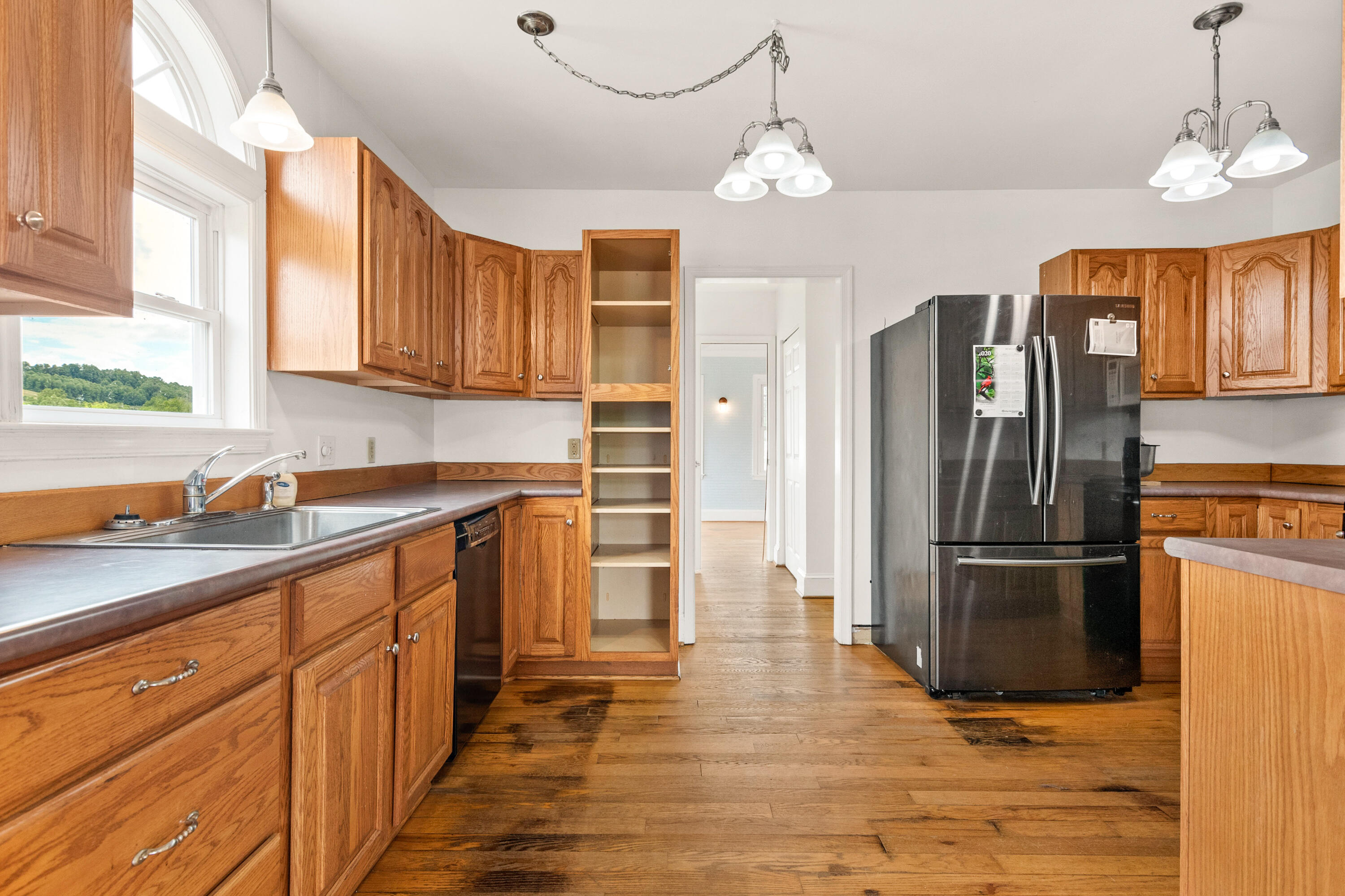223 Conner Grove Road Southwest Willis, VA 24380 - Photo 13 of 74 a kitchen with stainless steel appliances granite countertop a refrigerator a sink dishwasher a stove and a refrigerator with wooden floor