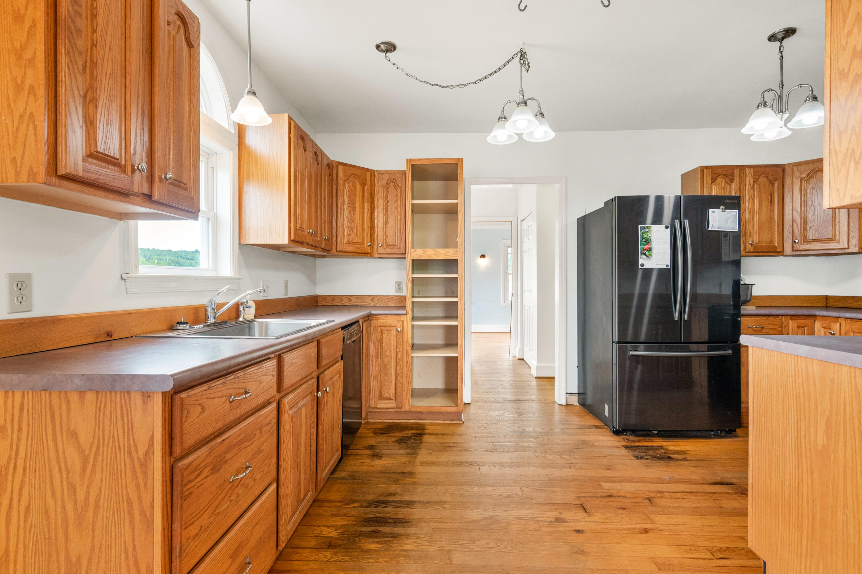 223 Conner Grove Road Southwest Willis, VA 24380 - Photo 15 of 74 a kitchen with stainless steel appliances granite countertop a refrigerator a sink dishwasher a stove and a refrigerator with wooden floor